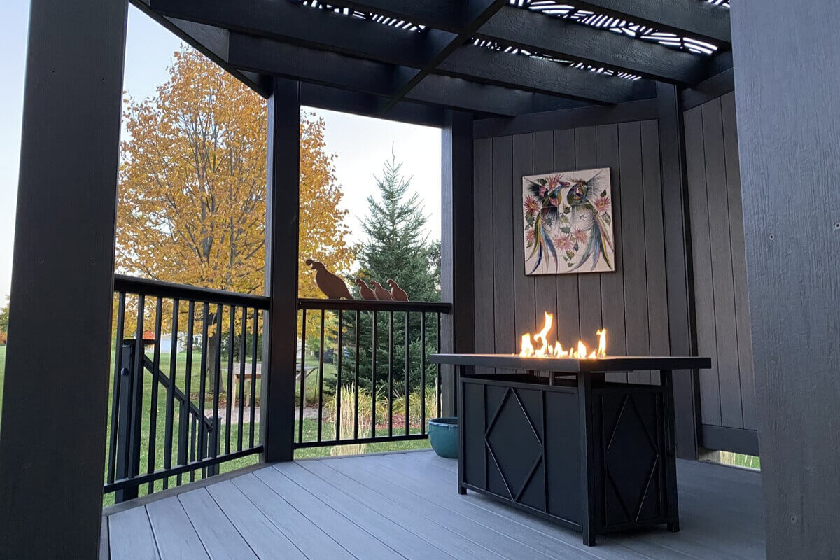 C10 – TBZ – 0155 (7) (1) (1) Covered deck with black fencing