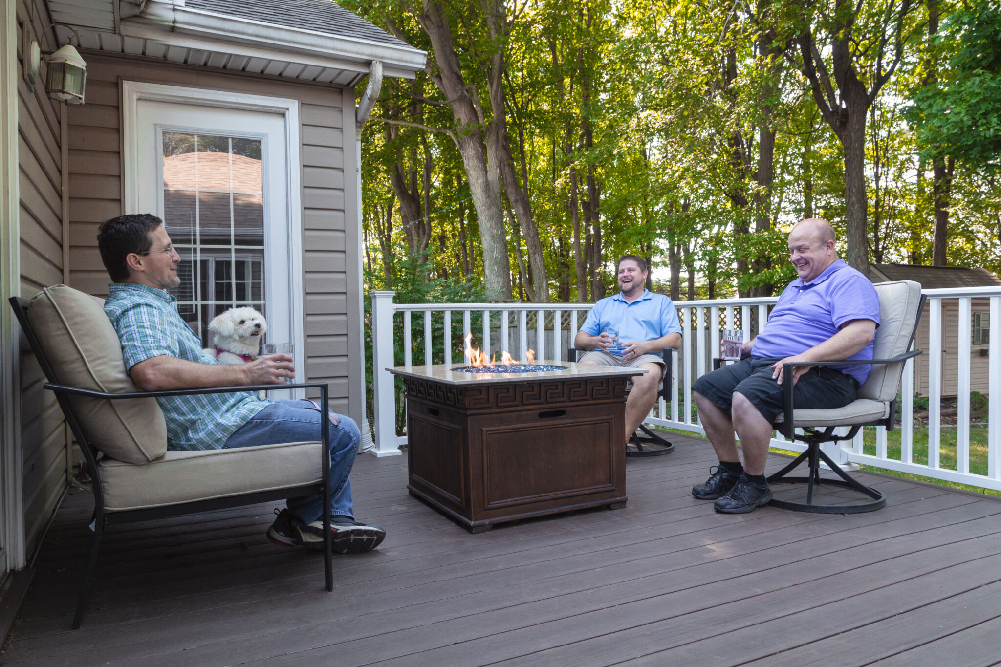 friends enjoying a fire on the deck